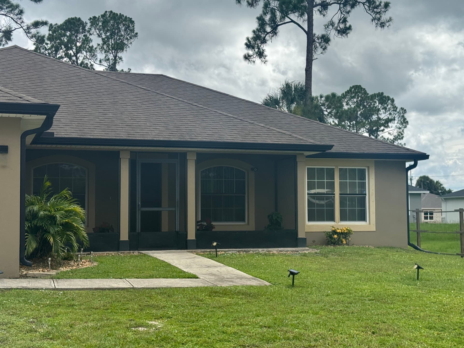 Screened front entryway enclosure on a Florida home
